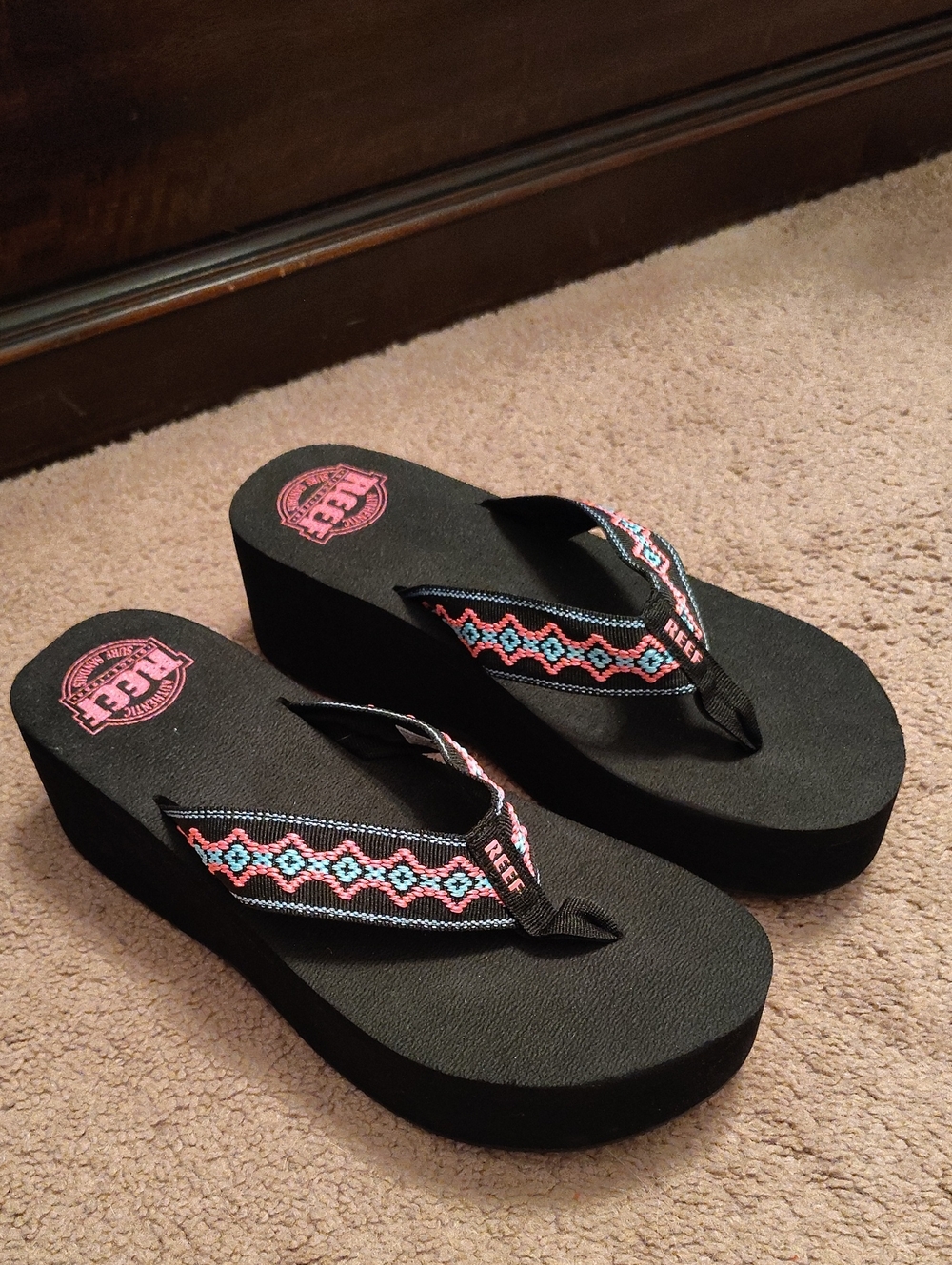 Reef Black Platform Flip Flops with Pink & Teal Patterned Straps